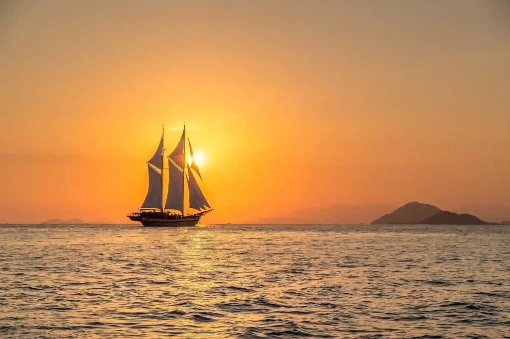 Phinisi sailing through Komodo National Park