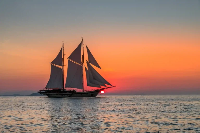 Phinisi silhouetted at sunset in Komodo